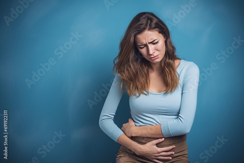 woman in pain holding her belly, stomach ache