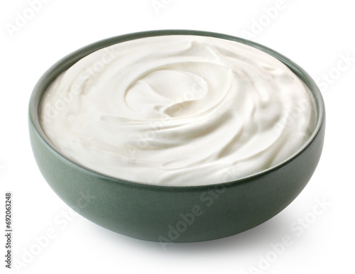 Green ceramic bowl of fresh greek yogurt or sour cream