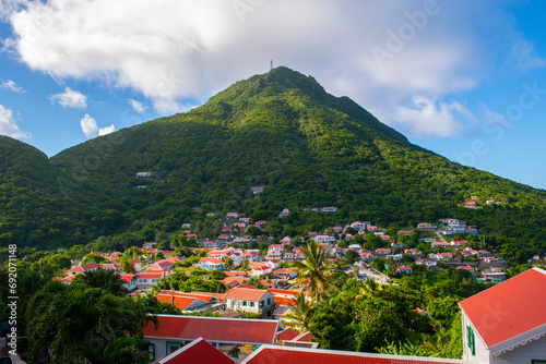 Windwardside historic town center in the morning with Mount Scenery at the background in Saba, Caribbean Netherlands. Mount Scenery is a dormant volcano still active today. 