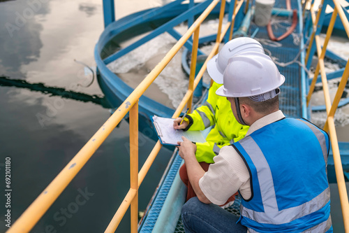 Environmental engineers work at wastewater treatment plants,Water supply engineering working at Water recycling plant for reuse