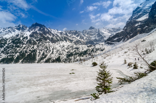 Winter Mountain landscape of Morskie oko in Tatra national park. Icy Sea Eye lake in Tatra mountains