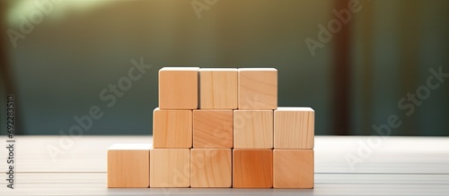 Achieving goals and succeeding in business through corporate regulations and compliance with a wooden cube.