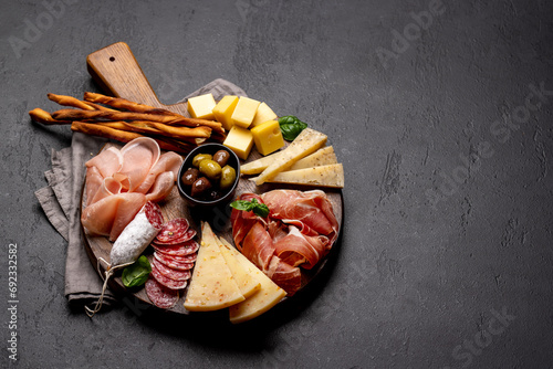 Antipasto board with various meat and cheese snacks