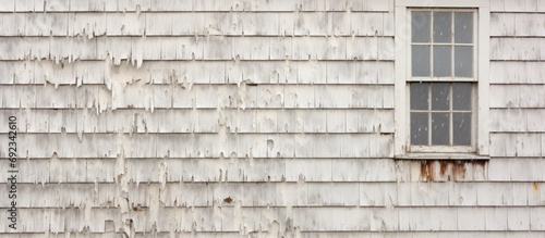 Damaged house siding from hail storm.