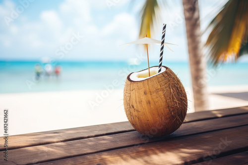 Fresh coconut coctail on the beach in beautiful lagoon