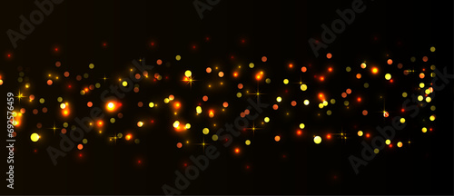 Yellow and orange shiny bokeh with christmas stars on dark background