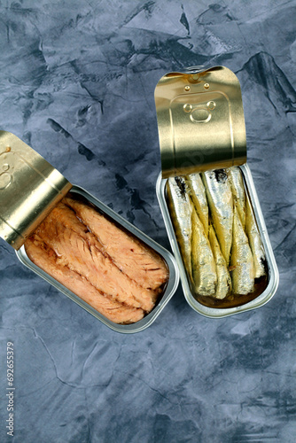 Two cans of canned sardines and mackerel in olive oil