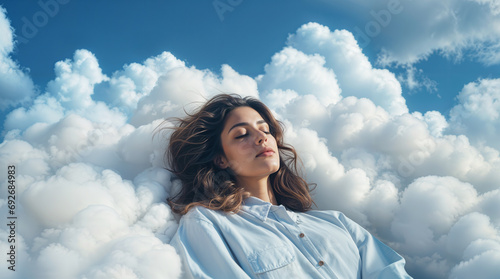 Beautiful latina woman sleeping and dreaming on clouds, representing deep good sleep and relaxation, soft fluffy cloud and blue sky, hd