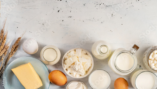 assorted dairy products on wooden table, natural lighting. Caption space. 