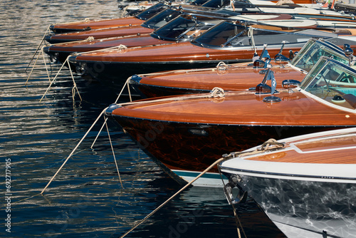 Few luxury retro motor boats in row at the famous motorboat exhibition in the principality of Monaco, Monte Carlo, the most expensive boats for the richest people, boats for rich clients