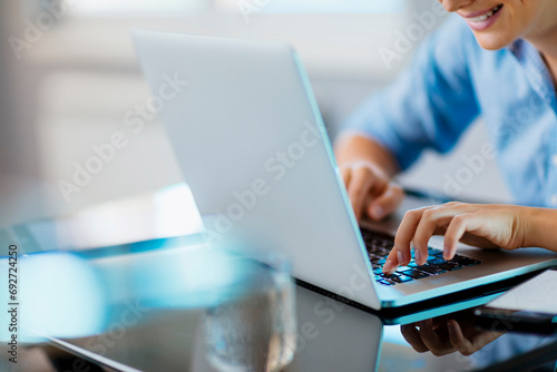 Woman typing on the laptop