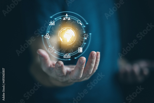 Businessman hand showing transformation of ideas and the adoption of technology in business in the digital age, enhancing global business capabilities Ai, IoT, internet of things. 
