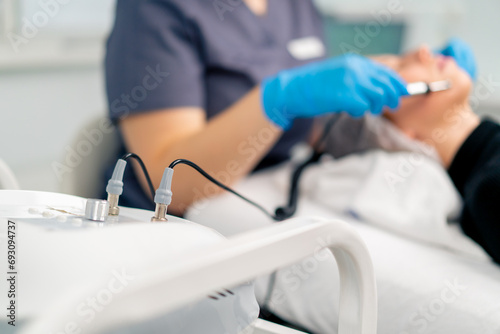 Close-up of an apparatus for massaging the face with electric current in a cosmetic cabinet in a beauty salon