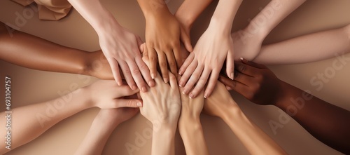 Business people making a pile of hands. 