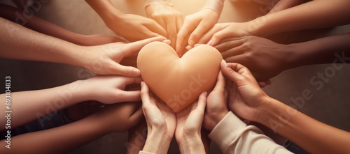 a group of diverse hands forming a heart