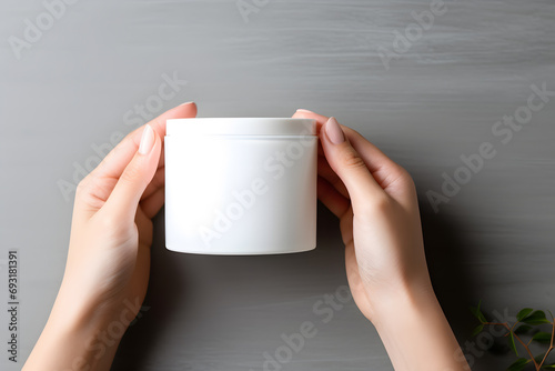 Female hands holding jar of cosmetic cream Cosmetic beauty product branding mockup