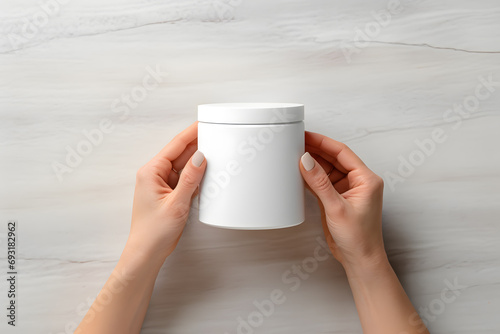 Female hands with white medical plastic jar of multivitamin capsules or pills. Mockup