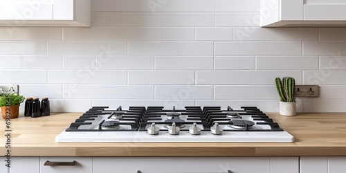 New gas hob cooker on kitchen counter in renovated house for sale or rent in UK.
