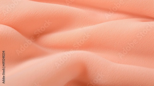 Closeup of a Peach Fuzz offshoulder top, showcasing a soft and stretchy fabric that will accommodate your growing belly.
