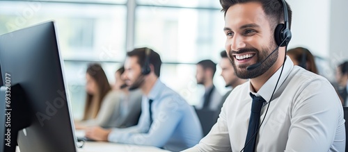 Smiling call center agent on computer, assisting and answering customer calls