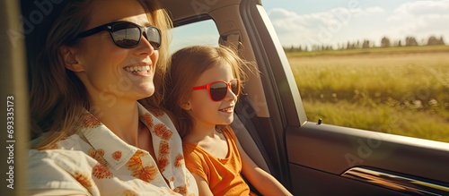 Mother and child travel by car for a happy road trip to a soccer activity, bonding and smiling along the way.