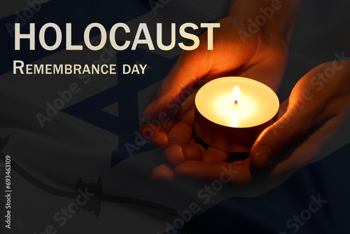 Holocaust Remembrance Day. Woman holding burning candle and flag of Israel, double exposure