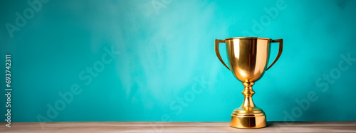 Golden trophy on turquoise background, winning theme with bright contrast. Victory concept. Generative AI