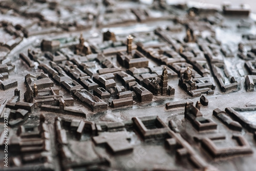 Layout of the old district of Lviv in miniature. A metal model of a medieval city, made of metal and installed in the Rynok Square. Close-up.