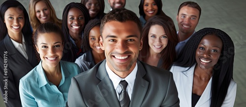 Diverse group encouraging attractive black businessman.