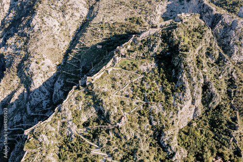 Aerial view of the St. John fortress and serpentine roads in the mountains. Kotor, Montenegro