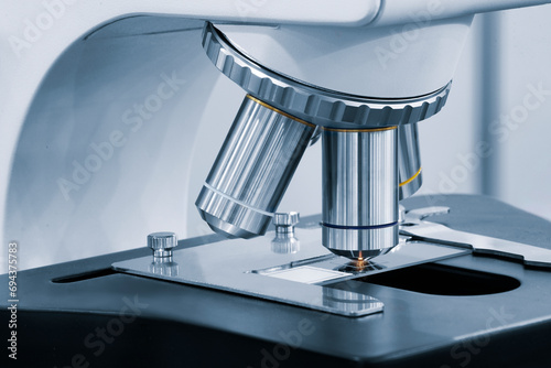 Close up microscope in the laboratory. A laboratory technician makes microscopic bacteriological examination.