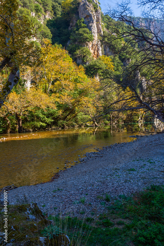 Landscape from Voidomatis river where the ravine of Vikos ends in a surrounding area of ​​mythical beauty. Vikos–Aoös National Park. Konitsa Province. Ioannina. Greece.
