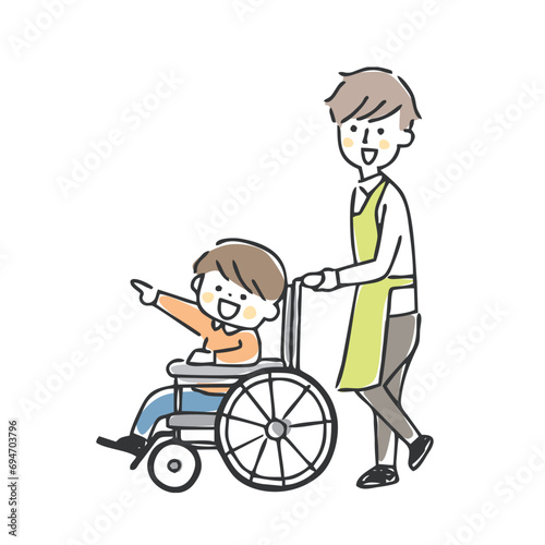 車椅子の男の子と男性スタッフ