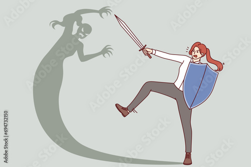 Woman fights with own shadow, holding shield and sword for concept overcomes internal fears and barriers. Brave girl overcomes fear and gets rid of phobia that interferes with personal growth