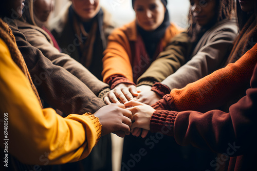 Business Team Huddle. Diverse Friends Hands Commitment.High angle view of a team of united coworkers standing with their hands together in a huddle.Ai
