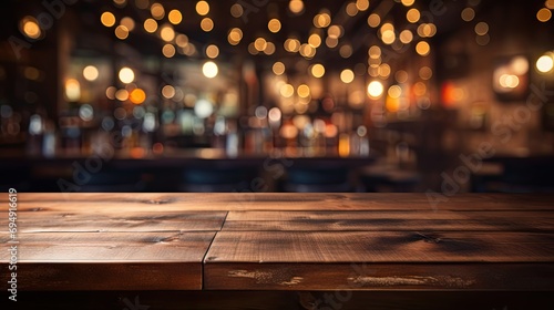 Empty wooden table in front of blurred café bar