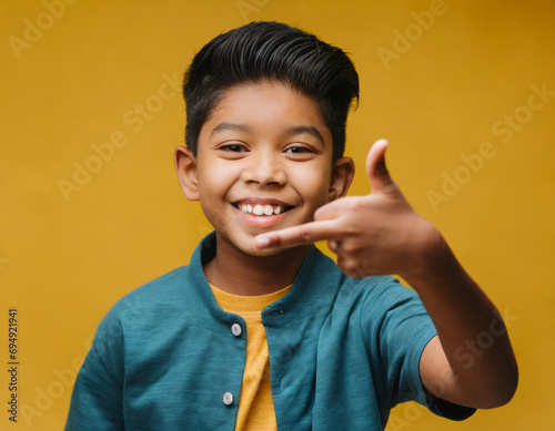 Cheerful Boy Playfully Showing Gesture with Middle Finger in Funny Portrait