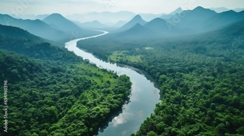 Aerial photography from a drone Beautiful view of the river in the green tropical forest of Southeast Asia with the river and mountains
