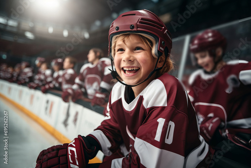 Smiling child hockey player on the ice of a hockey stadium. Hockey training
