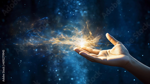 An open hand sticks out into the picture and golden sparks fly out of it, blue background