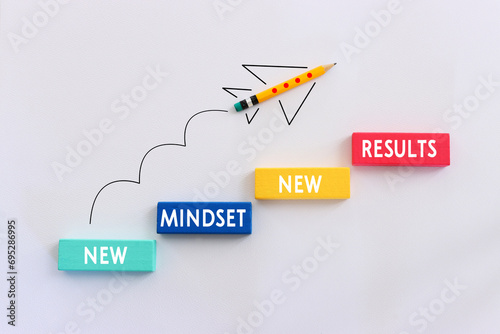 top view image of pencils with puzzle and the text new mindset. success and personal development concept