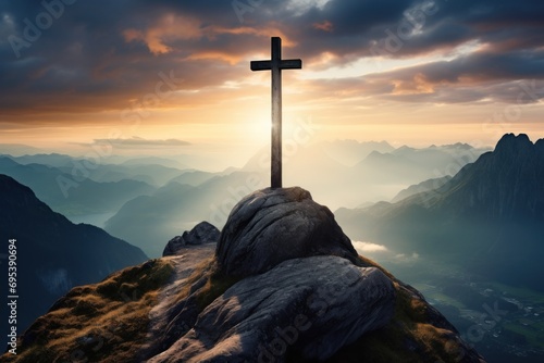  a cross on top of a mountain with the sun shining through the clouds over the mountains in the distance, with the sun shining through the clouds in the sky.