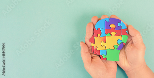 ASD autism spectrum disorder, deficits in social communication and interaction, mind with colorful jigsaw or puzzle pieces 