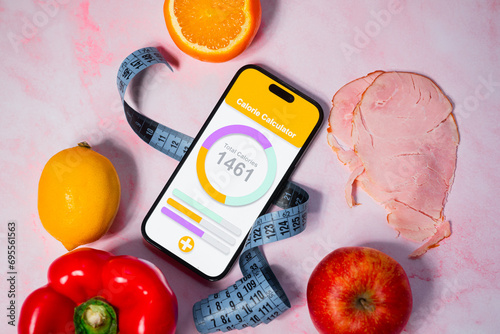 An application for counting calories next to healthy eating. Calorie deficit and weight loss. Maintaining a healthy and balanced diet