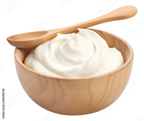 Sour cream in wooden bowl and spoon isolated.