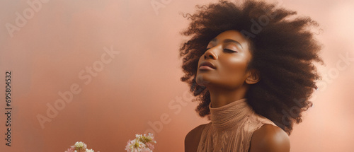 African american woman with afro hairstyle and flowers, panoramic shot