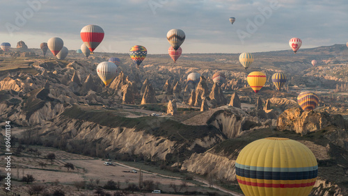plenty of hot-air balloons flying over the fairy chimneys, Göreme, Cappadocia, Turkey