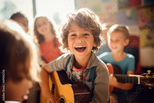 young children playing guitar in classroom