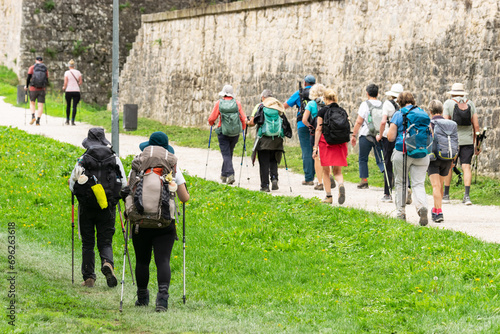 Couples and group Doing the Way of St. James. Walls of Pamplona, ​​Navarra 