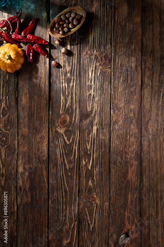 Rustic wooden surface featuring autumn harvest accents, perfect for fall season compositions, with a top-down perspective and space for text
